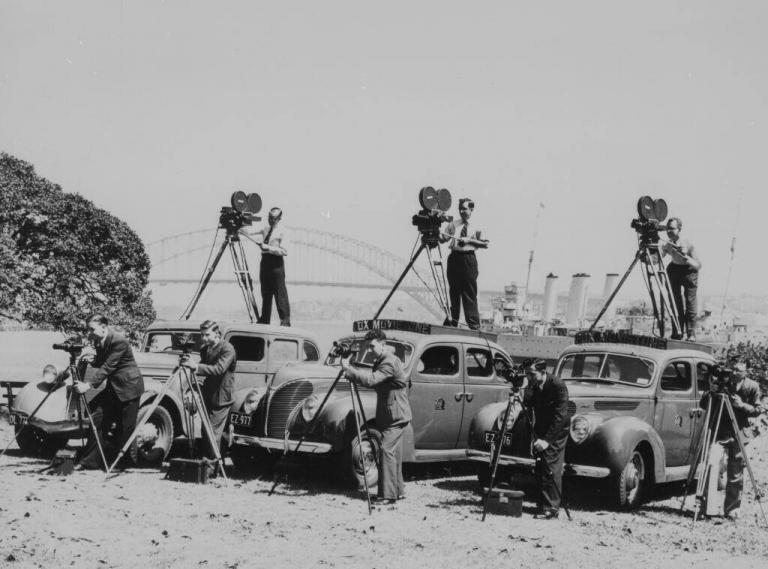 Antique photo of men filming with cameras